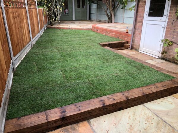 Patio with Brick Walling and Railway Sleepers in Chelmsford