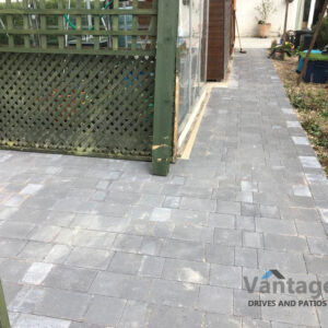 Tegula and Porcelain Slabbed Patio and Pathway in Ongar