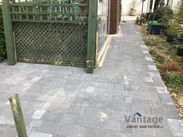 Tegula and Porcelain Slabbed Patio and Pathway in Ongar