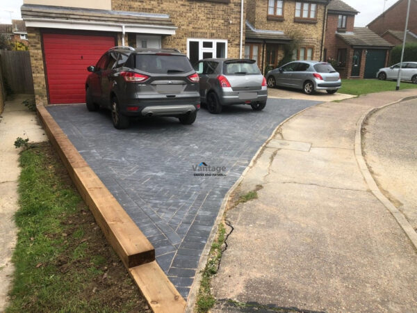 Charcoal Paved Driveway with Sleeper Retaining Wall in Chelmsford