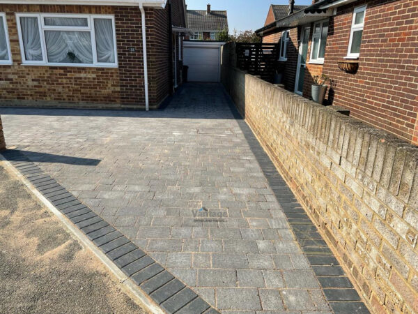 Driveway with Rumbled Block Paving and New Brick Wall in…