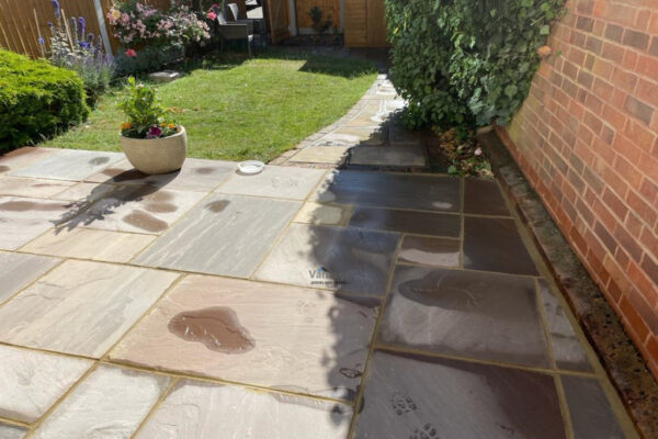 Indian Sandstone Slabbed Patio with Step in Ongar, Essex (4)