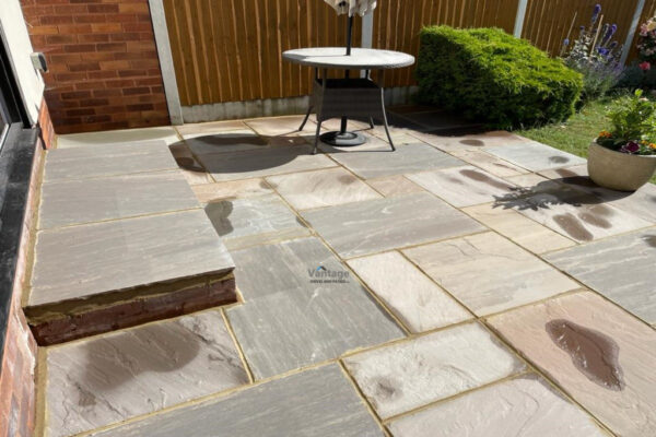 Indian Sandstone Slabbed Patio with Step in Ongar, Essex