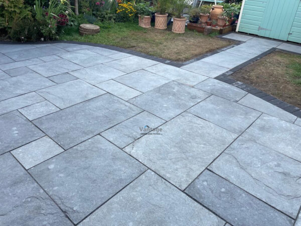 Patio With Silver Limestone Slabs And Charcoal Paved Border In Chelmsford, Essex (7)