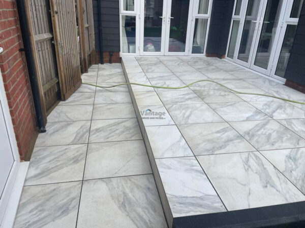 Patio with Porcelain Slabs and Bull-Nose Edging in Chelmsford