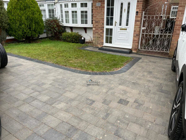 Driveway with Silver Grey Tegula Paving and Damson Border in…
