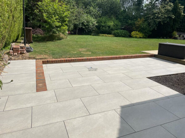 Porcelain Tiled Patio with Brickwork Wall in Chelmsford