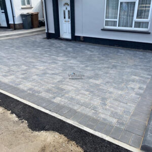 Driveway with Silver Grey Tegula Paving and Bull-Nose Kerbing in…